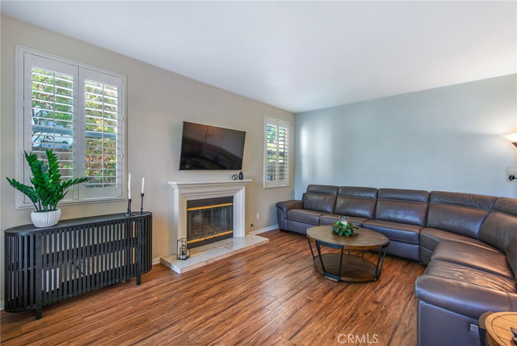 36 Cameray Heights Laguna Niguel, CA 92677 - Photo 3 of 27 a living room with furniture a fireplace and a flat screen tv