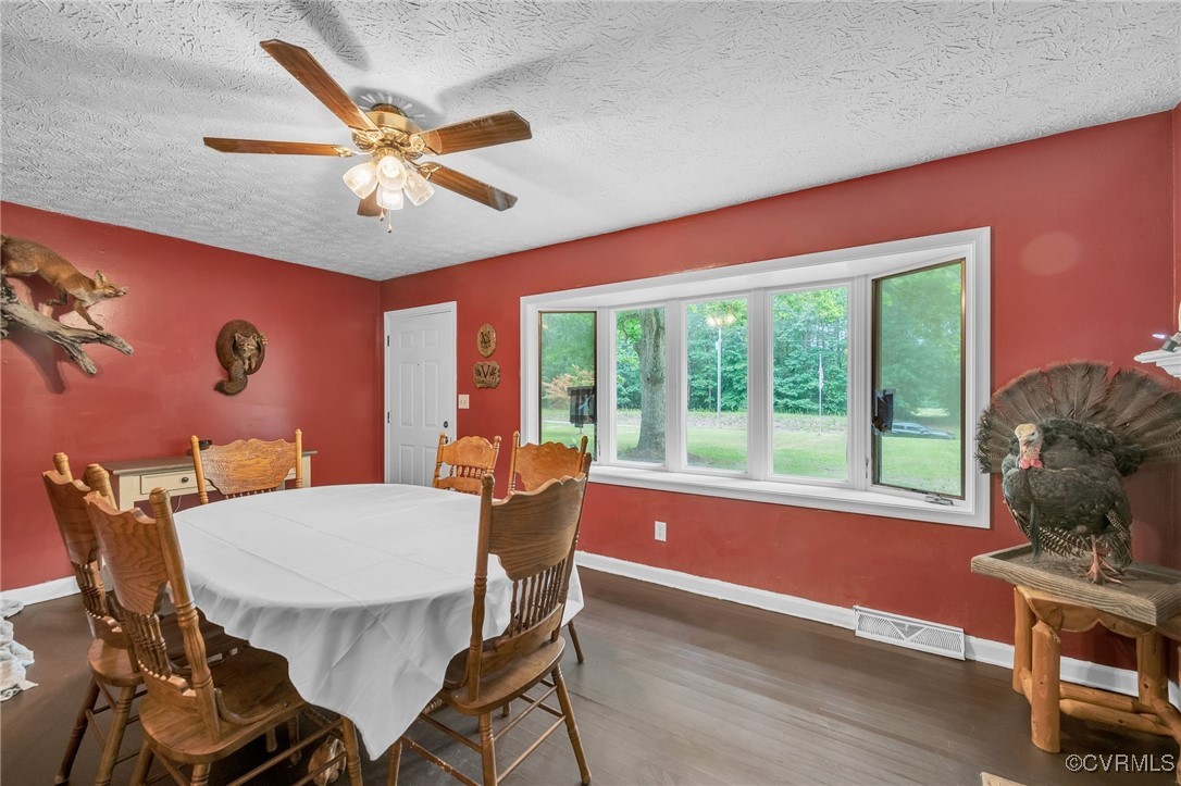 1305 Pea Rdg Road Bruington, VA 23023 - Photo 11 of 32 Dining room with a textured ceiling, wood finished