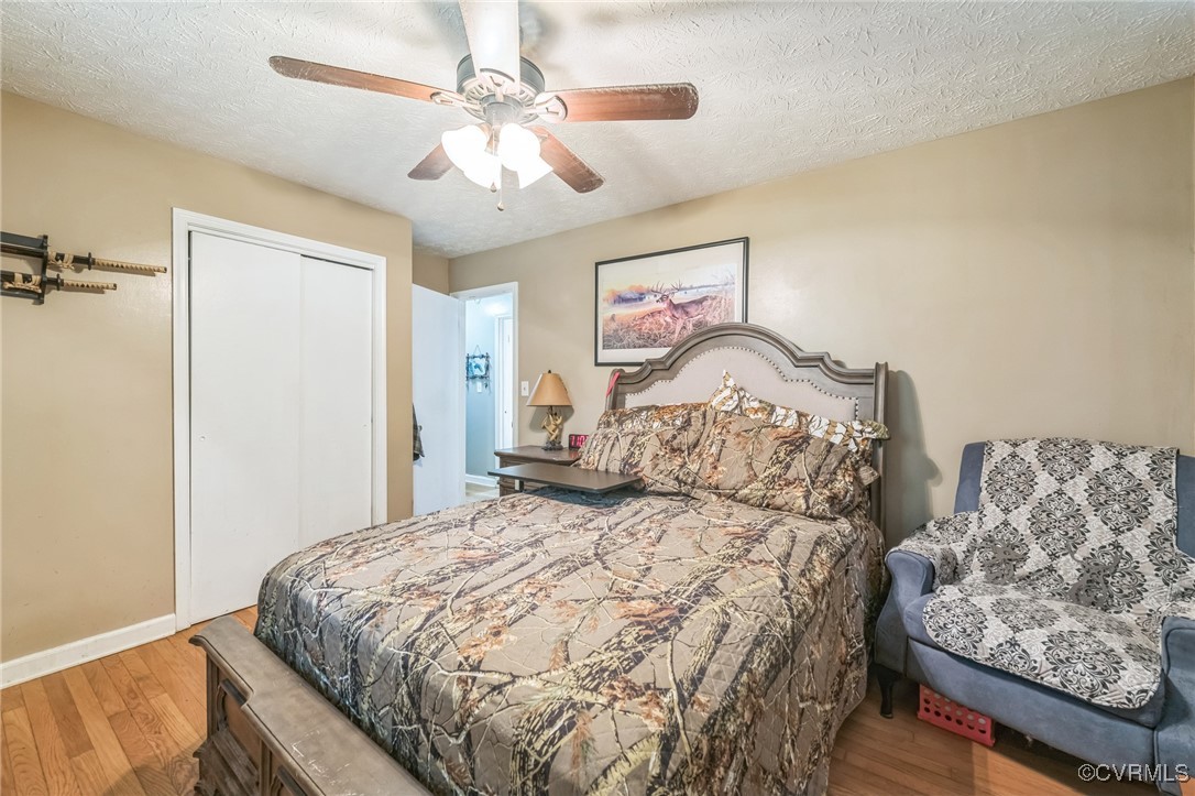 1305 Pea Rdg Road Bruington, VA 23023 - Photo 18 of 32 Bedroom featuring wood finished floors, a closet,