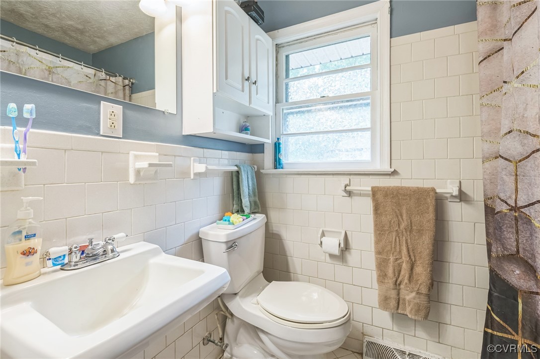 1305 Pea Rdg Road Bruington, VA 23023 - Photo 19 of 32 Bathroom with tile walls and toilet