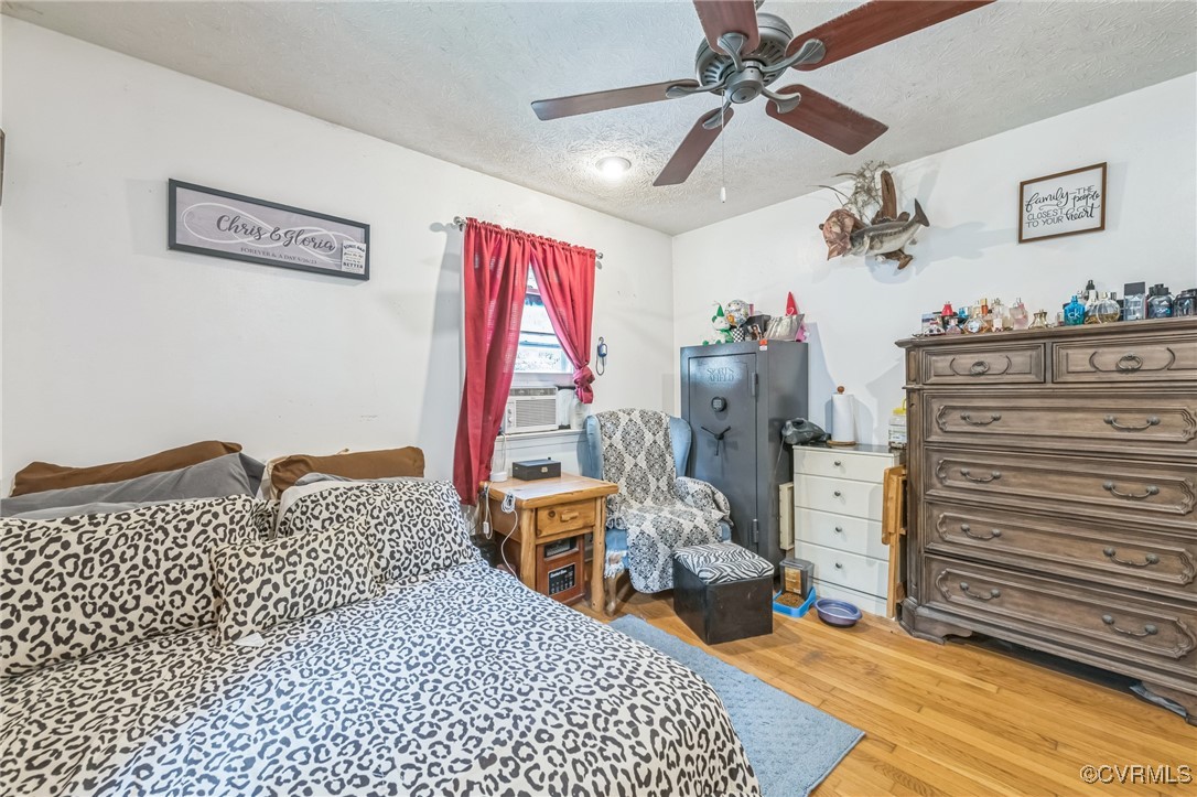 1305 Pea Rdg Road Bruington, VA 23023 - Photo 22 of 32 Bedroom with a textured ceiling, cooling unit, lig