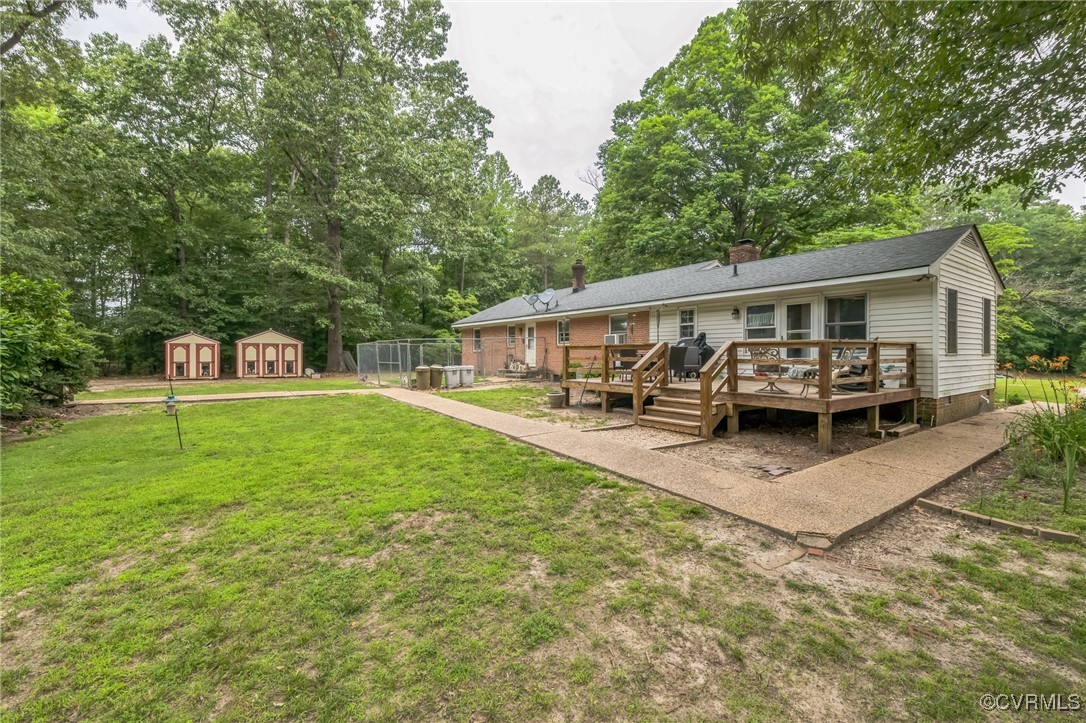 1305 Pea Rdg Road Bruington, VA 23023 - Photo 24 of 32 Rear view of house with a lawn, a deck, a chimney,