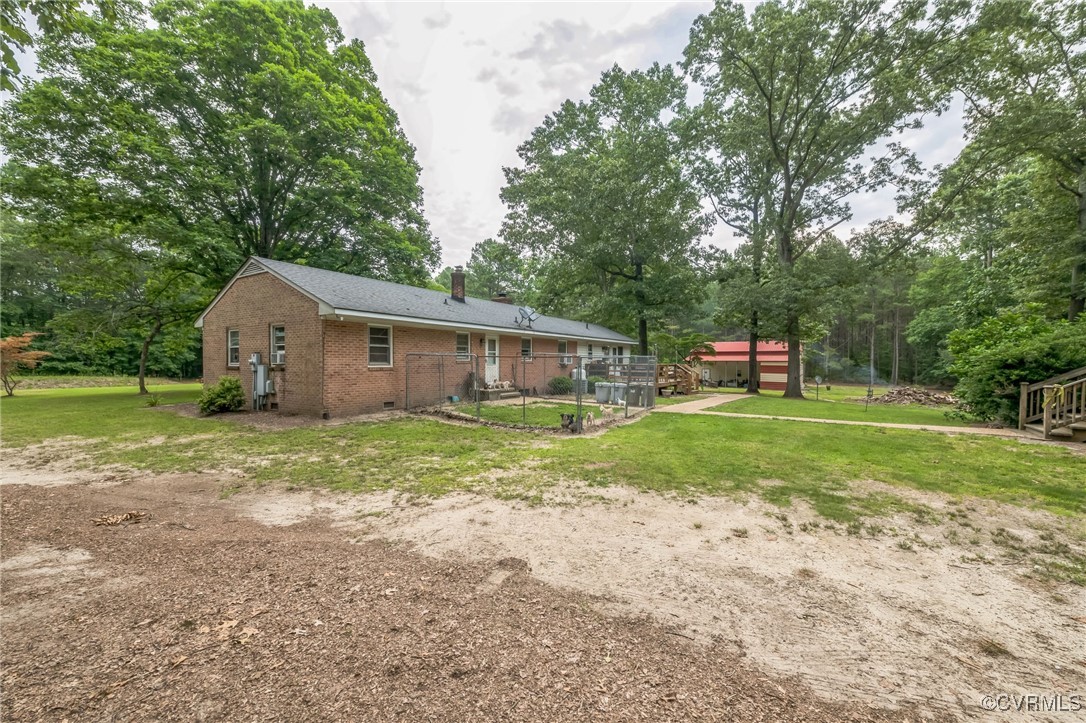 1305 Pea Rdg Road Bruington, VA 23023 - Photo 25 of 32 Back of property with brick siding, a chimney, a l