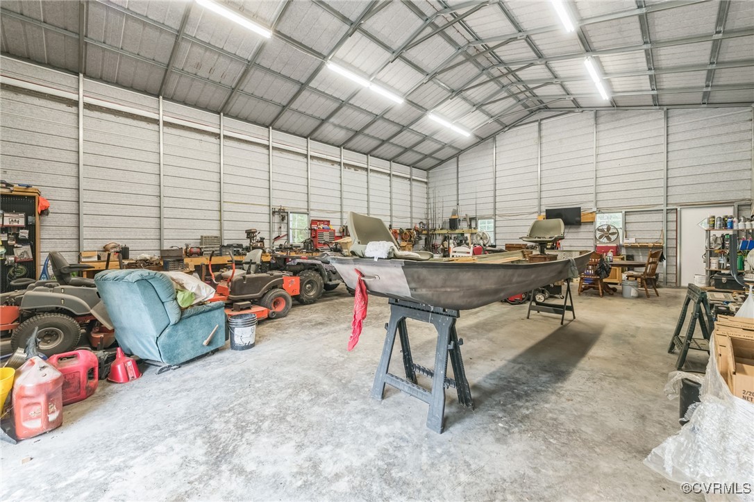 1305 Pea Rdg Road Bruington, VA 23023 - Photo 32 of 32 Garage featuring metal wall and a workshop area