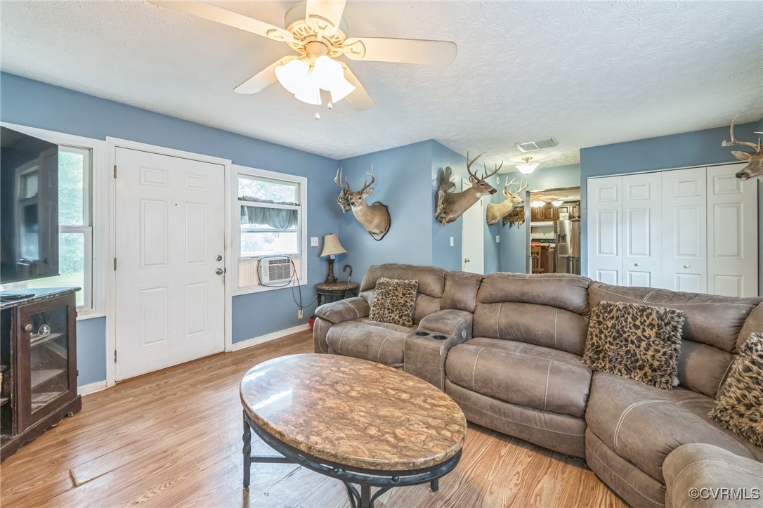 1305 Pea Rdg Road Bruington, VA 23023 - Photo 4 of 32 Living room with light wood-style flooring, a ceil