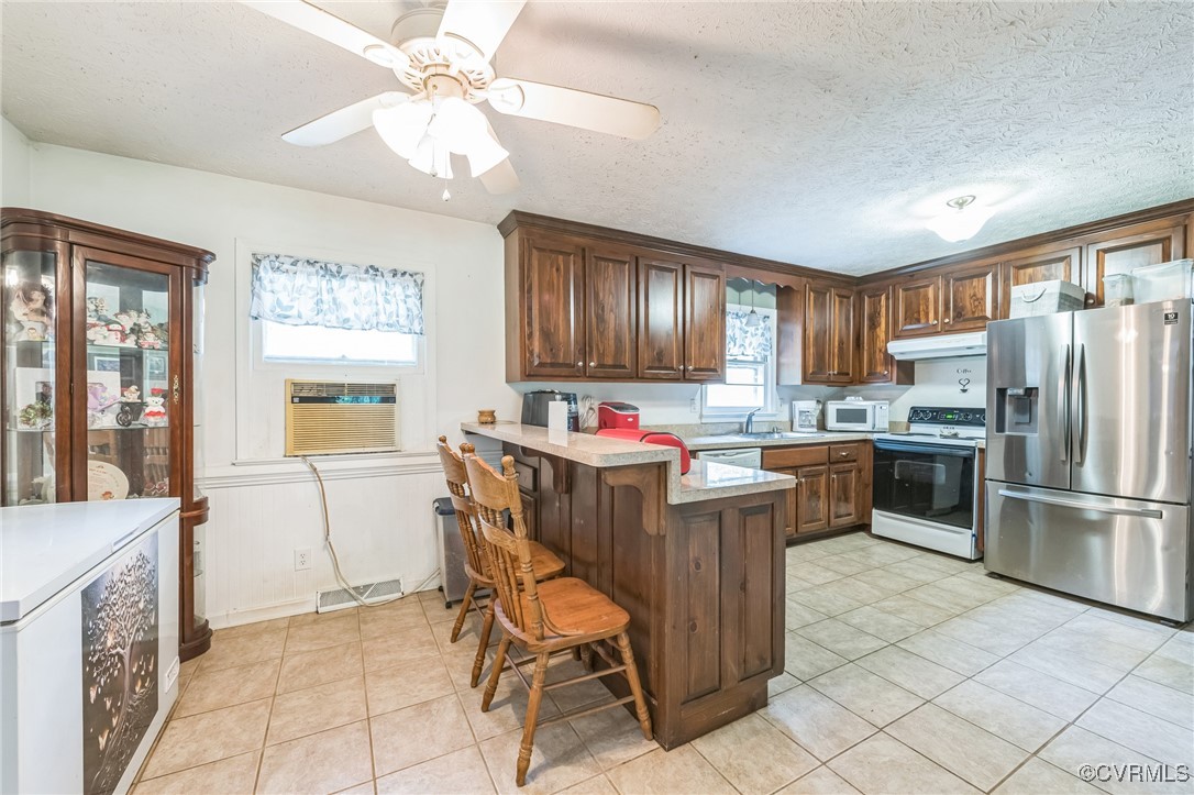 1305 Pea Rdg Road Bruington, VA 23023 - Photo 6 of 32 Kitchen featuring white appliances, under cabinet