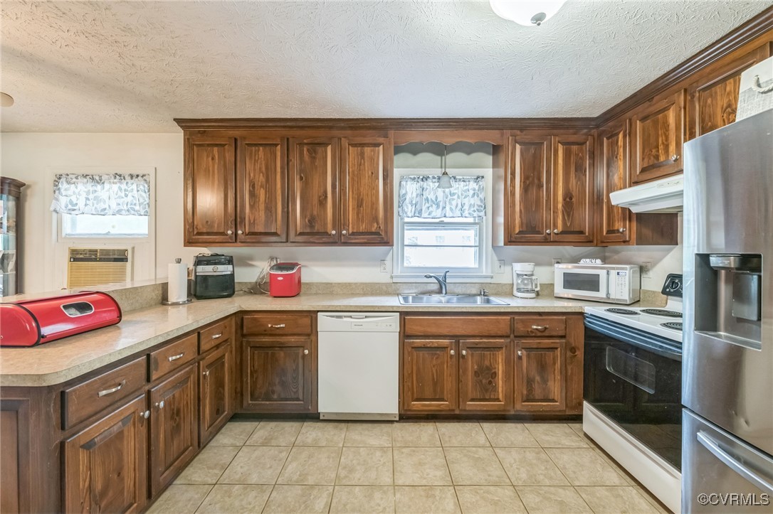 1305 Pea Rdg Road Bruington, VA 23023 - Photo 7 of 32 Kitchen with white appliances, under cabinet range