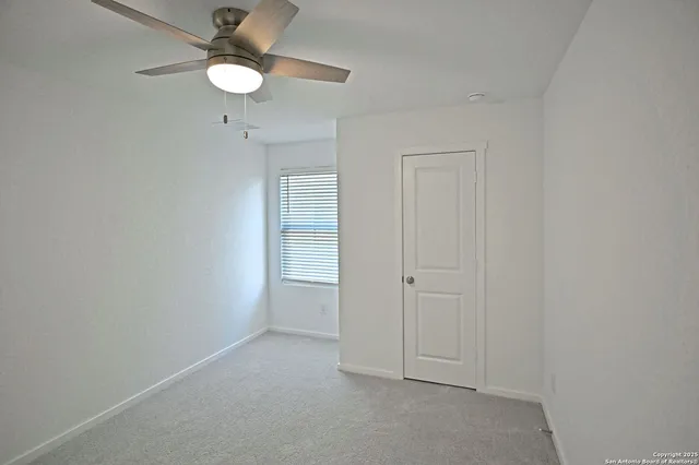 a kitchen with a sink and steel appliances