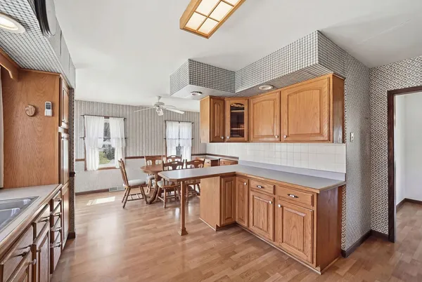 a view of a kitchen and dining room