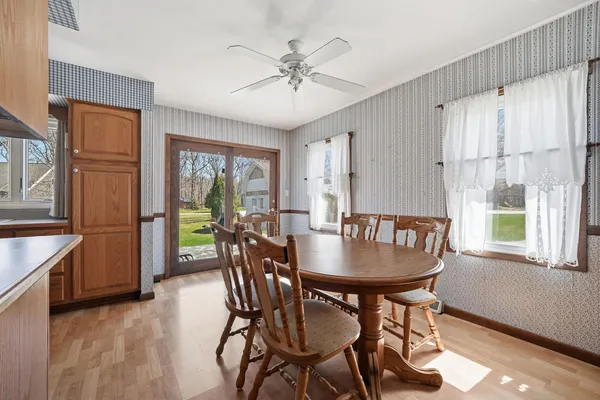 a dining room with furniture window wooden floor