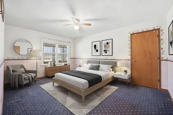 a bedroom with a bed and a couch