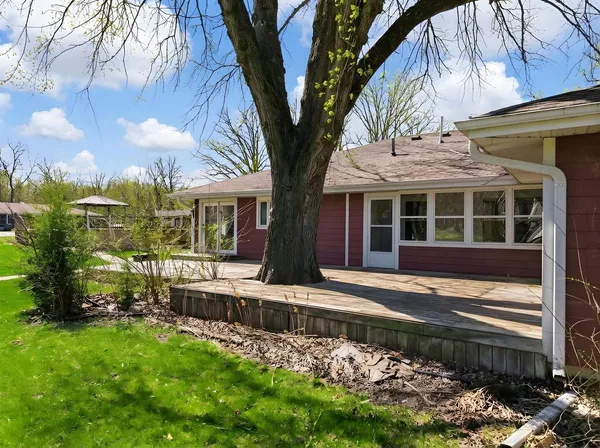 a view of house with a yard