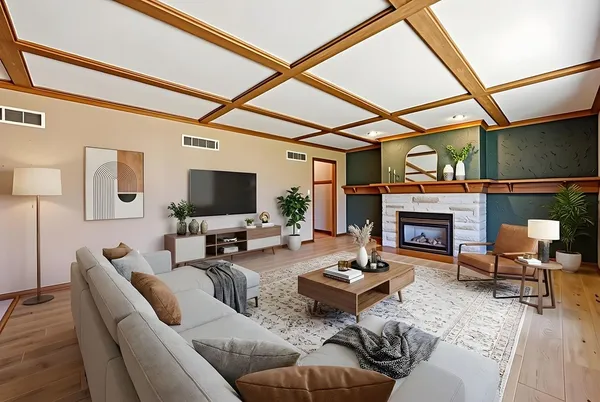 a living room with furniture a fireplace and a flat screen tv