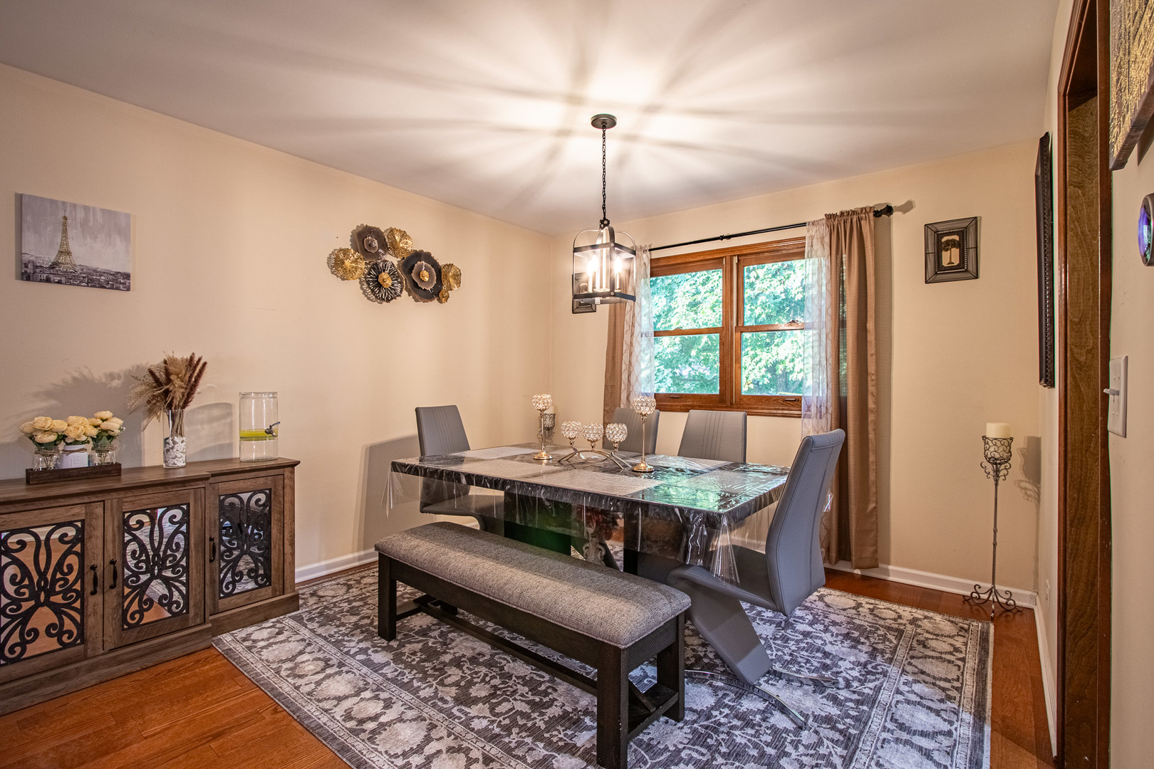 1201 Pinetree Lane Bartlett, IL 60103 - Photo 18 of 24 a view of a dining room with furniture window and wooden floor