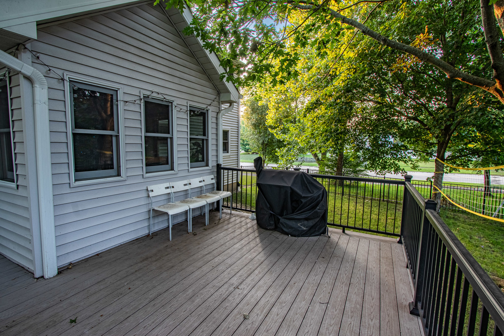 1201 Pinetree Lane Bartlett, IL 60103 - Photo 24 of 24 a view of a deck with table and chairs and wooden floor