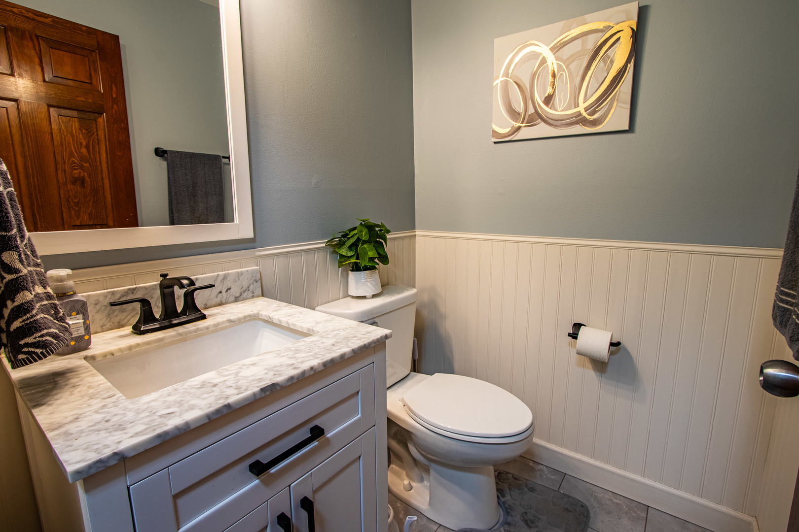 1201 Pinetree Lane Bartlett, IL 60103 - Photo 8 of 24 a bathroom with a granite countertop toilet sink and mirror