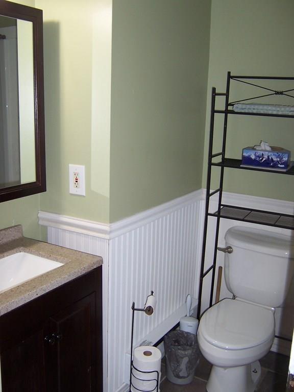 12 Hough Road Douglas, MA 01516 - Photo 13 of 22 a bathroom with a granite countertop toilet sink and mirror