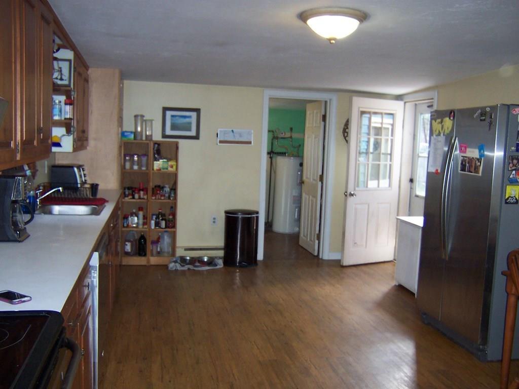 12 Hough Road Douglas, MA 01516 - Photo 5 of 22 a view of a room with wooden floor and windows