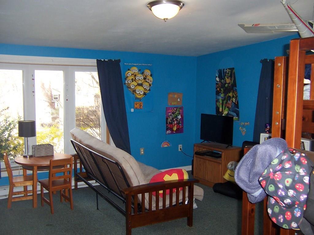 12 Hough Road Douglas, MA 01516 - Photo 6 of 22 a living room with furniture and a flat screen tv