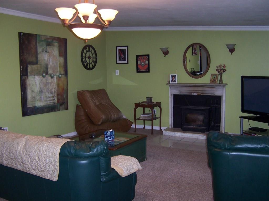 12 Hough Road Douglas, MA 01516 - Photo 10 of 22 a living room with furniture and a fireplace