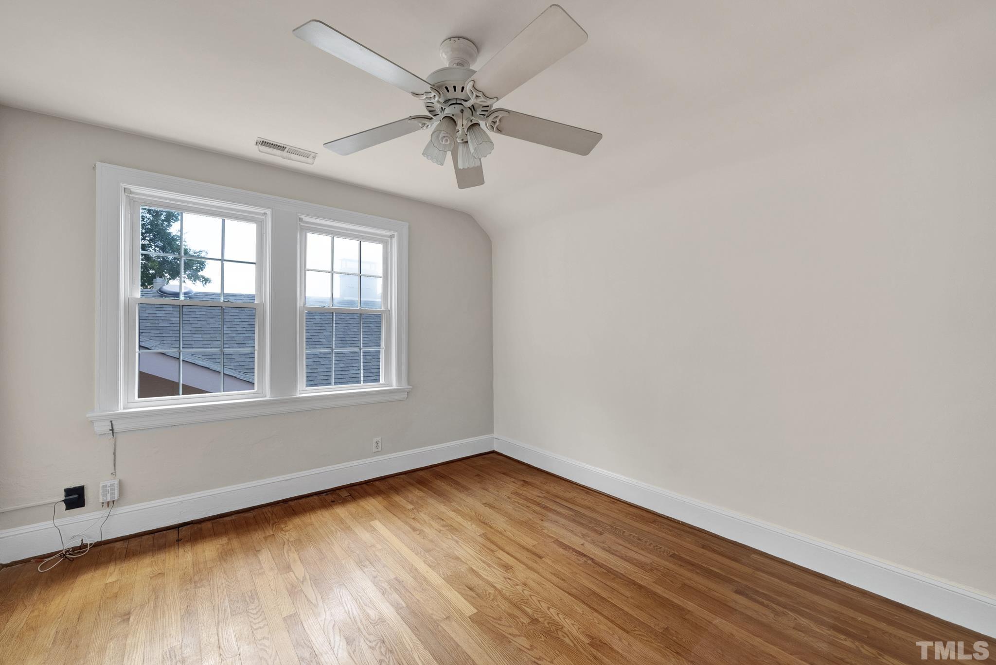 10 Dixie Trail Raleigh, NC 27607 - Photo 20 of 27 wooden floor in an empty room with a window