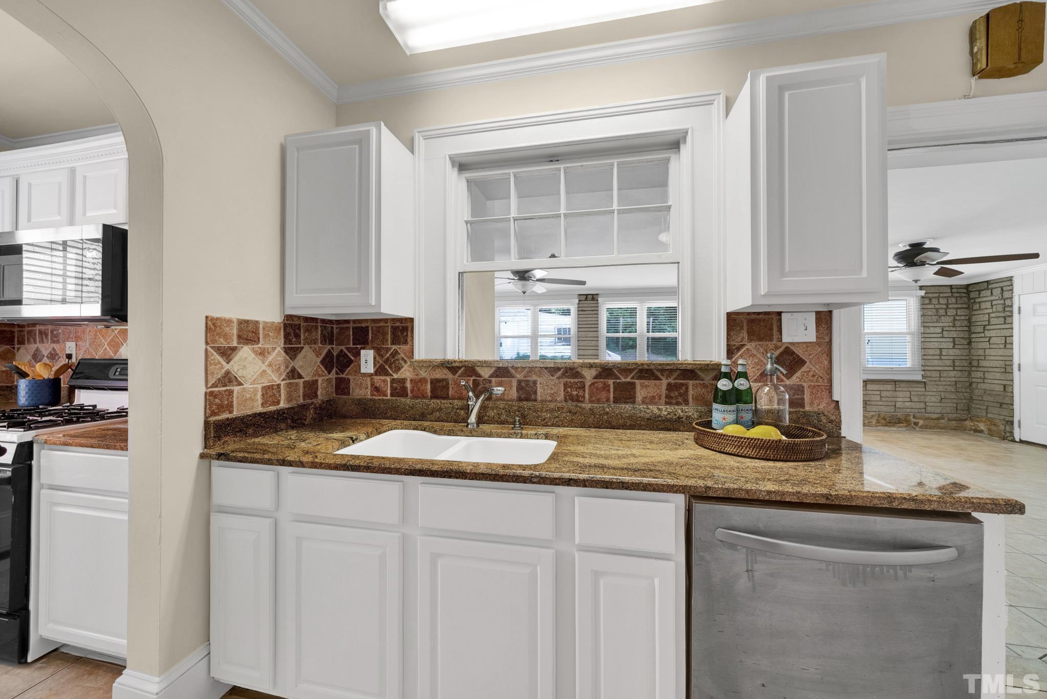 10 Dixie Trail Raleigh, NC 27607 - Photo 8 of 27 a kitchen with sink cabinets and window
