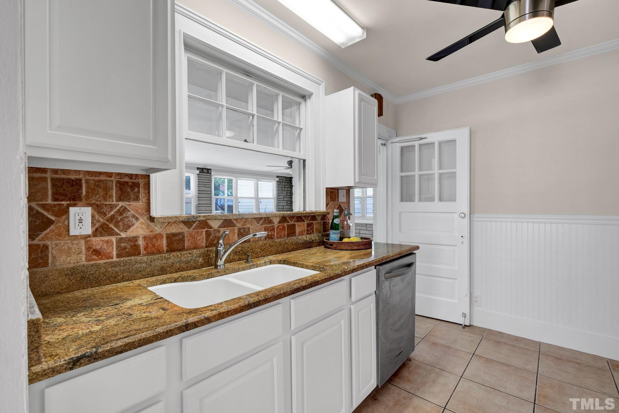 10 Dixie Trail Raleigh, NC 27607 - Photo 10 of 27 a kitchen with granite countertop a sink and a white cabinets