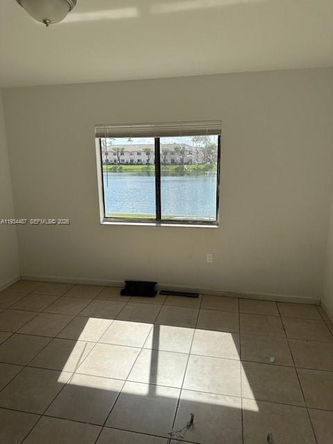 1250 Southeast 26th Street, Unit 102 Homestead, FL 33035 - Photo 9 of 16 a view of an empty room with a window