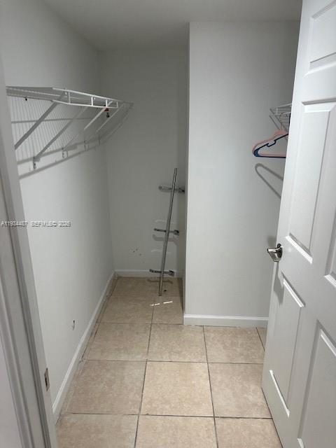 1250 Southeast 26th Street, Unit 102 Homestead, FL 33035 - Photo 10 of 16 a view of a room with racks on the wall