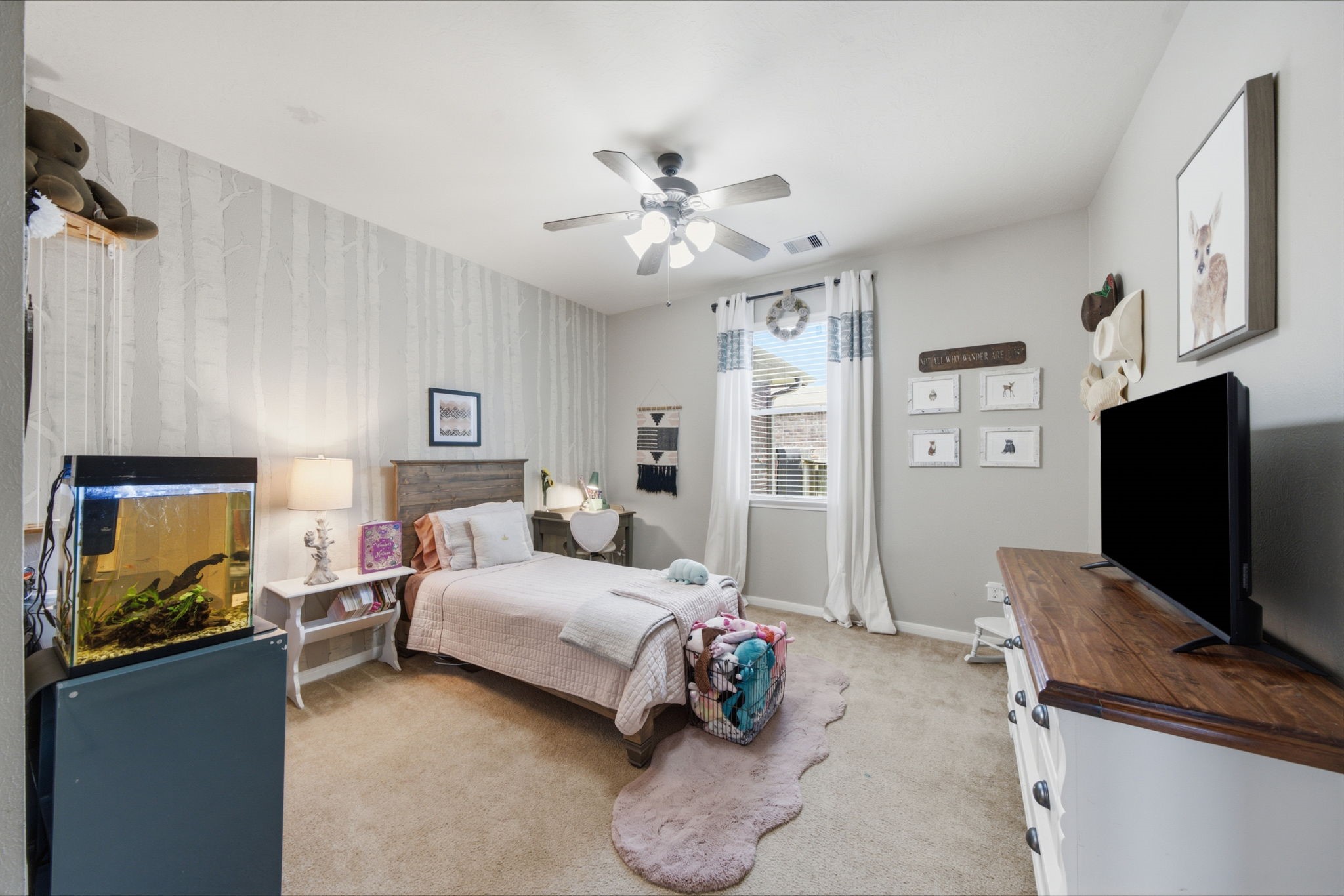 8911 Henrico Lane Rosenberg, TX 77469 - Photo 19 of 45 a bedroom with a bed and a flat screen tv
