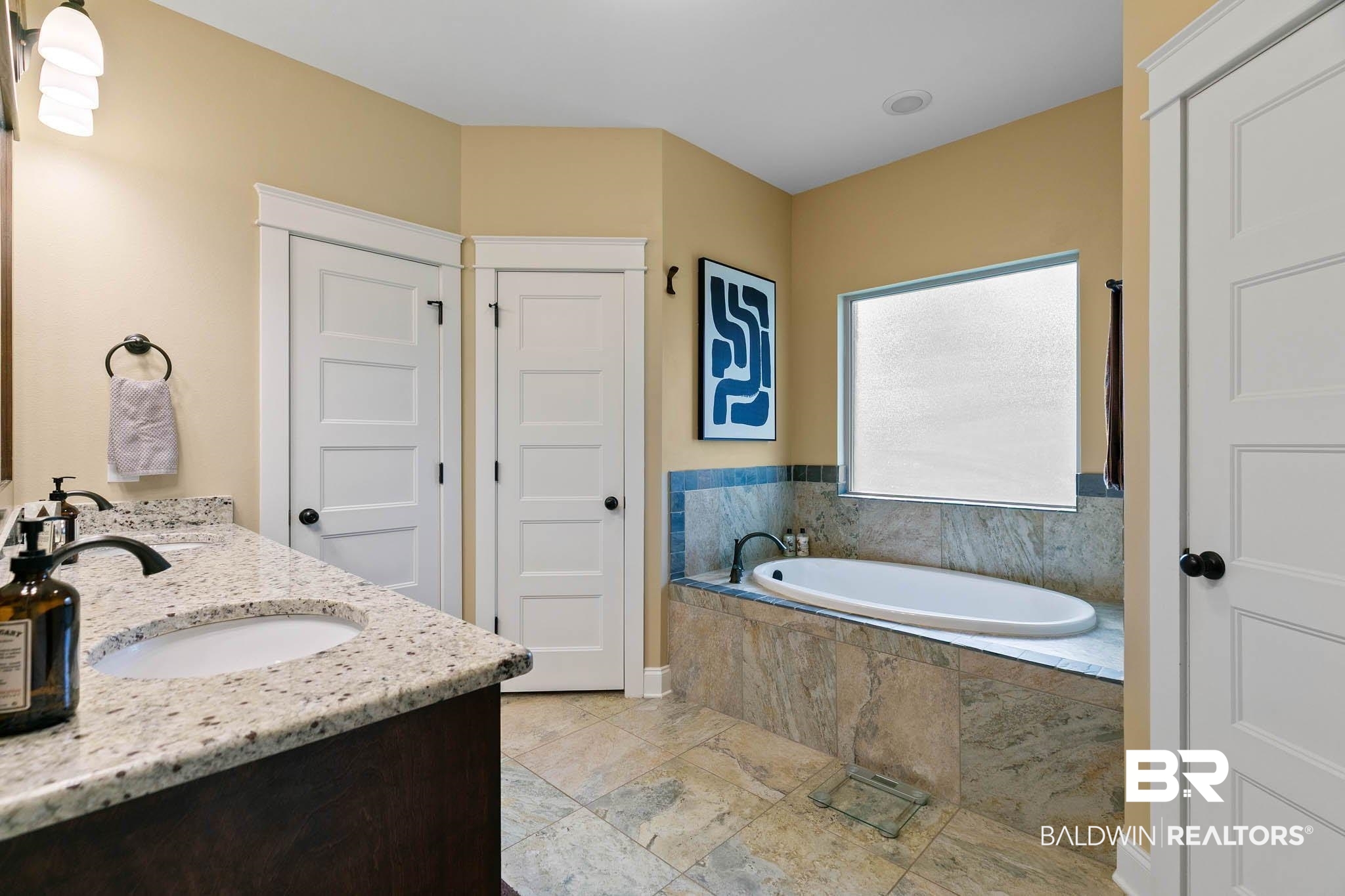 19740 Bunker Loop Fairhope, AL 36532 - Photo 20 of 33 Full bathroom featuring double vanity and a garden tub