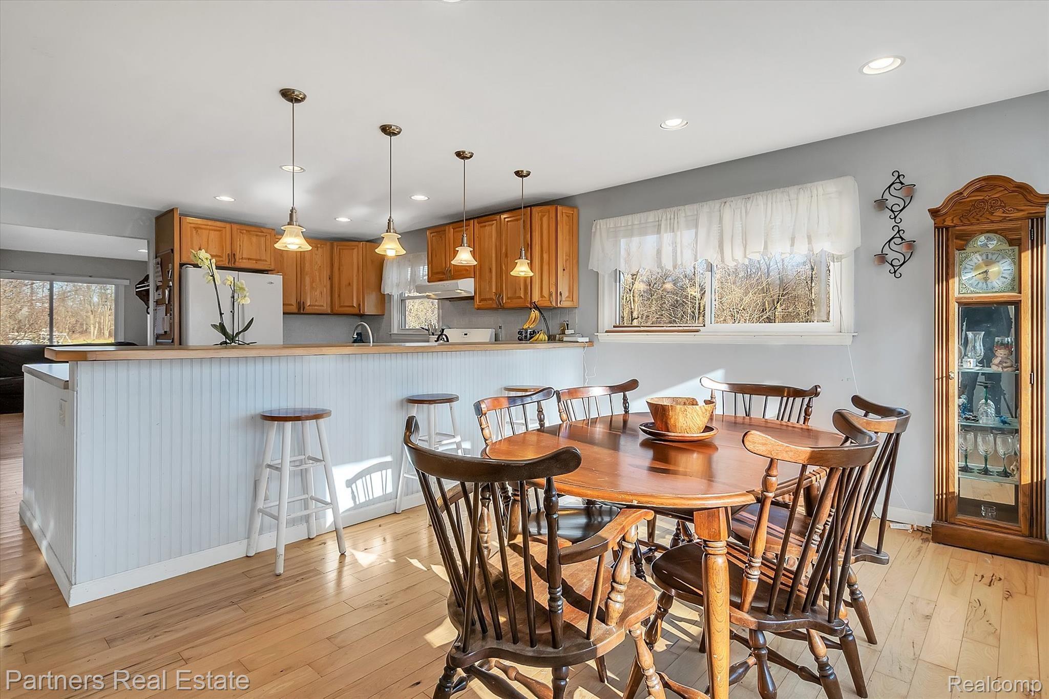 6400 Sharpe Road Fowlerville, MI 48836 - Photo 8 of 52 You can easily fit 6 or more bar stools at the large peninsula.