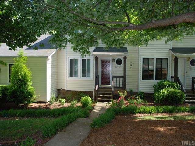 7612 Huey Court Raleigh, NC 27615 - Photo 1 of 6 a front view of a house with garden