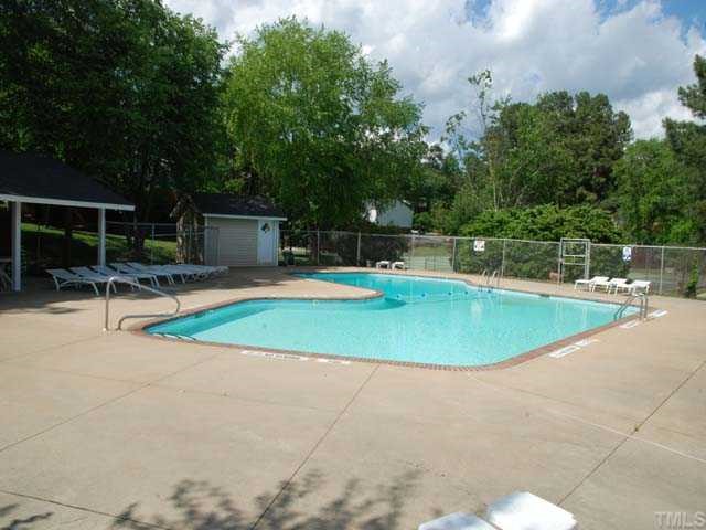 7612 Huey Court Raleigh, NC 27615 - Photo 5 of 6 a view of a swimming pool with a slide