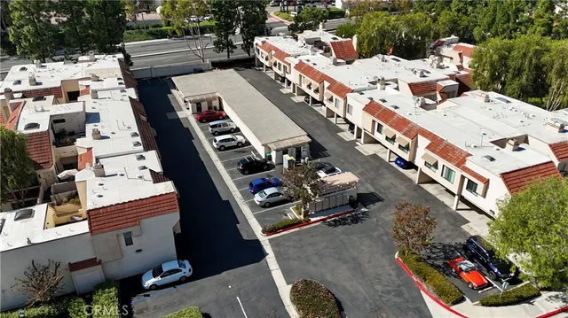 a front view of multi story residential apartment building with yard