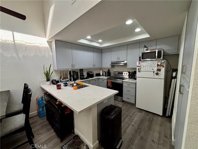 a kitchen that has a cabinets and a stove