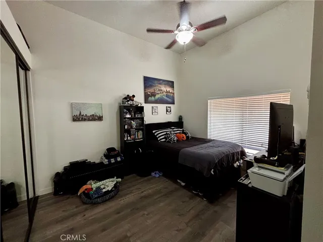 a bedroom with furniture and a window