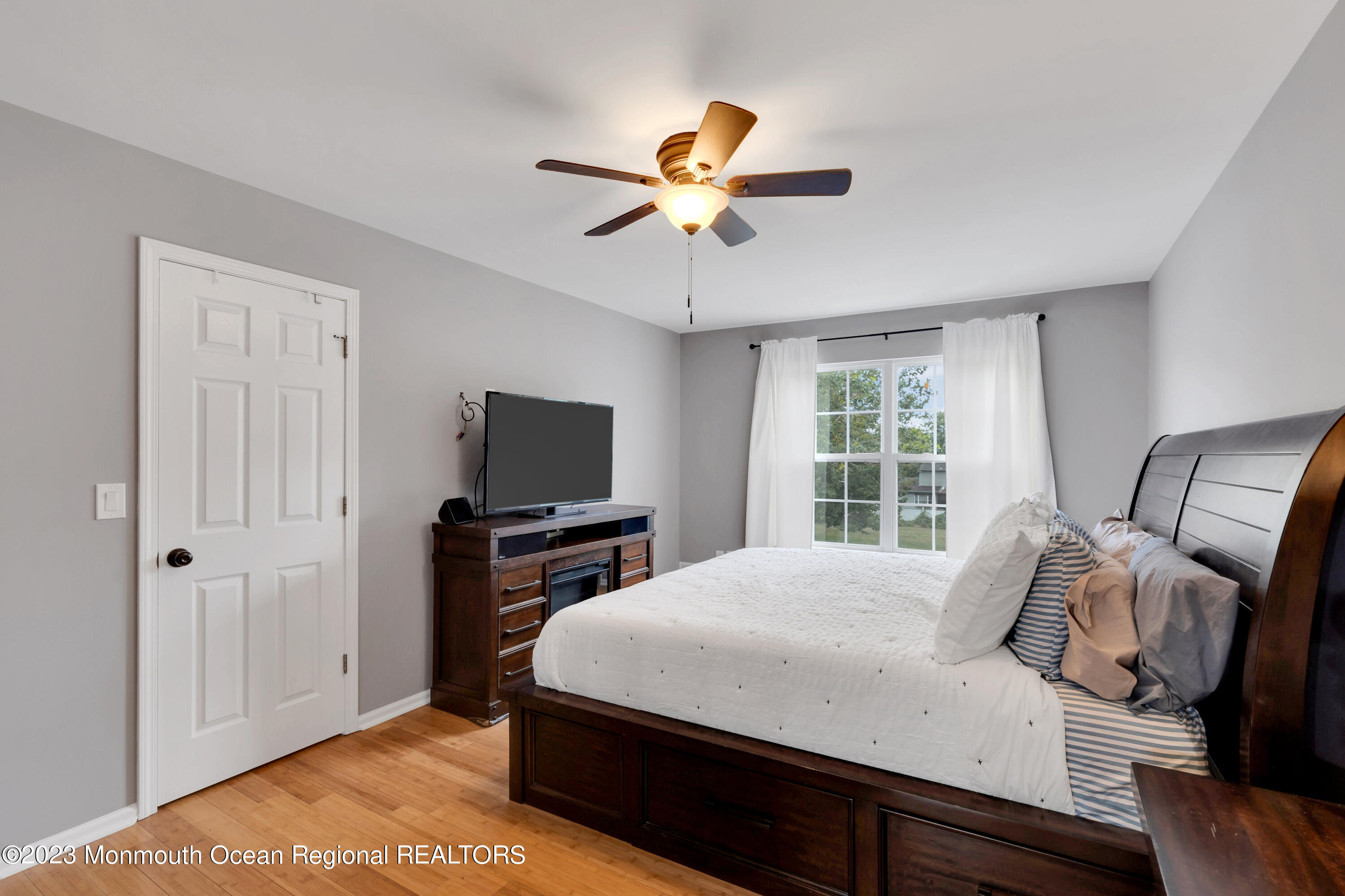 5 Autumn Drive Howell, NJ 07731 - Photo 35 of 50 a bedroom with a bed and a flat screen tv