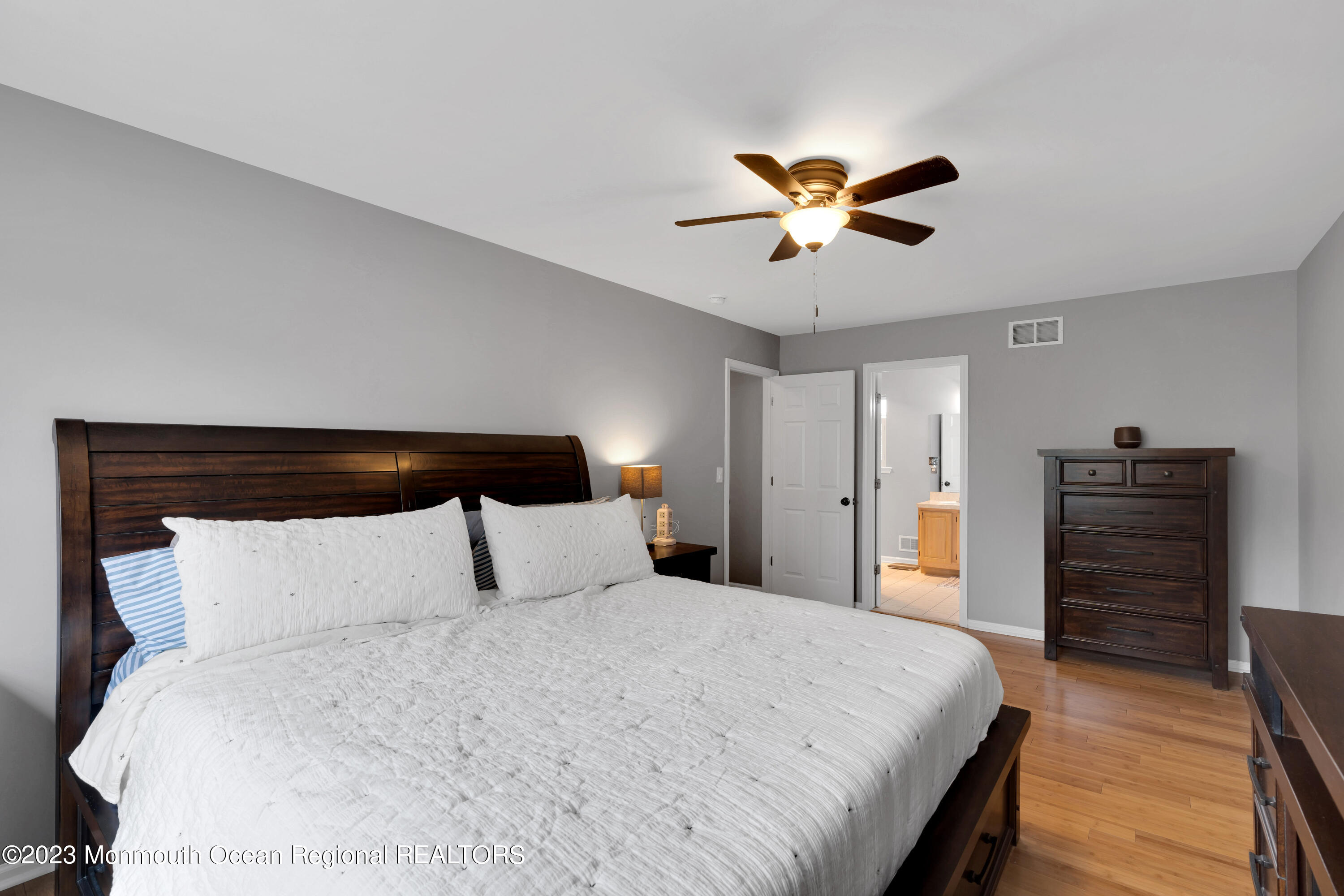 5 Autumn Drive Howell, NJ 07731 - Photo 4 of 50 a bedroom with a bed and a chandelier
