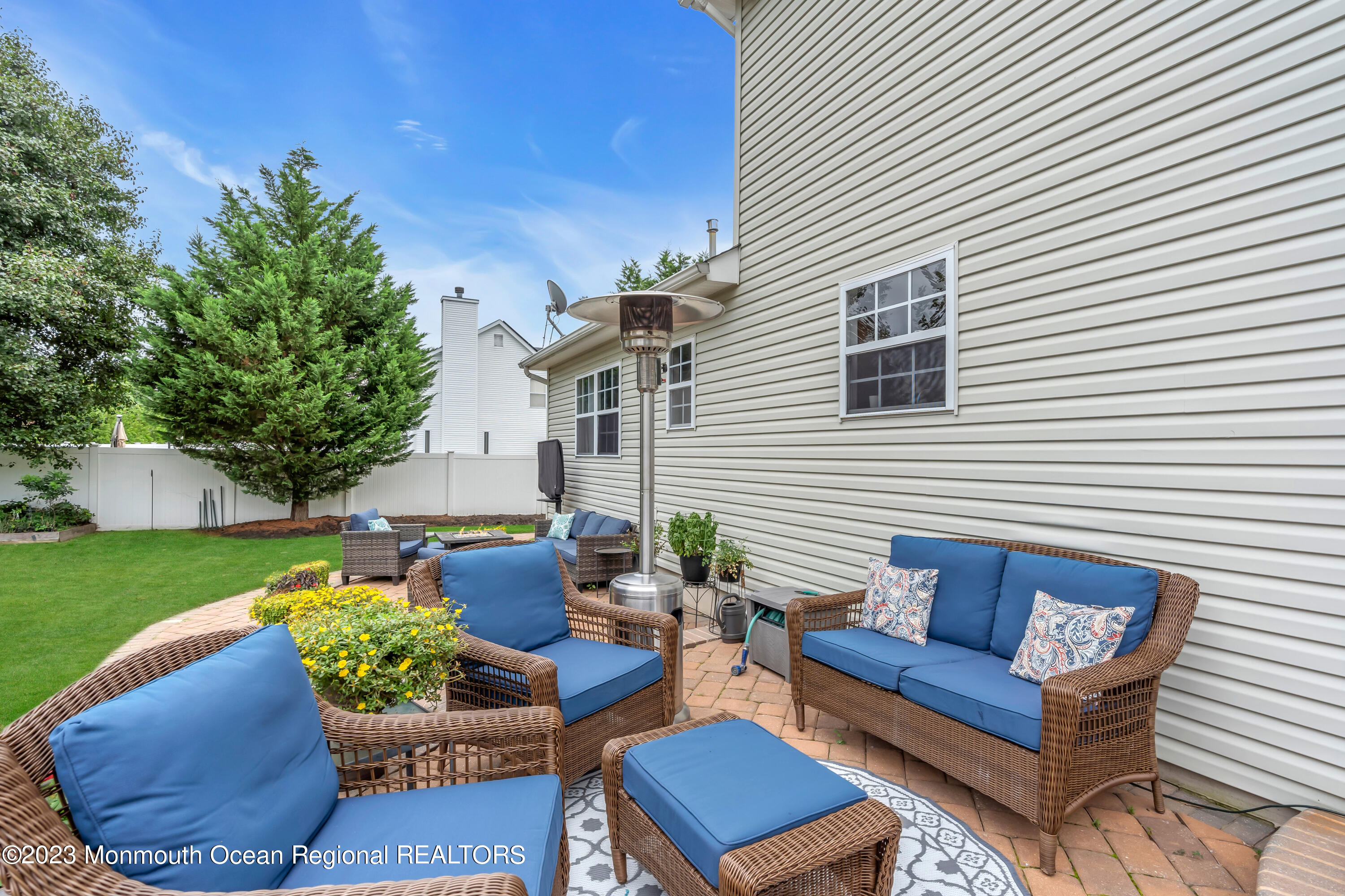 5 Autumn Drive Howell, NJ 07731 - Photo 43 of 50 a view of a patio with couches and a fire pit