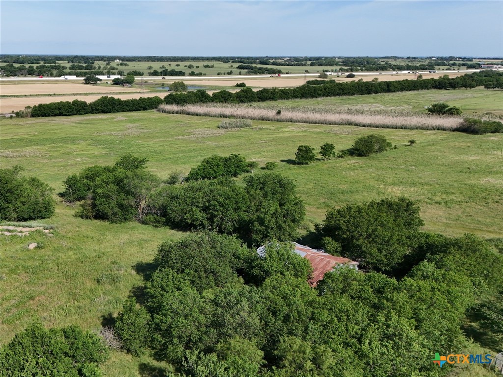 11179 Old Dallas Road West, TX 76691 - Photo 2 of 6 a view of a field with an ocean and trees