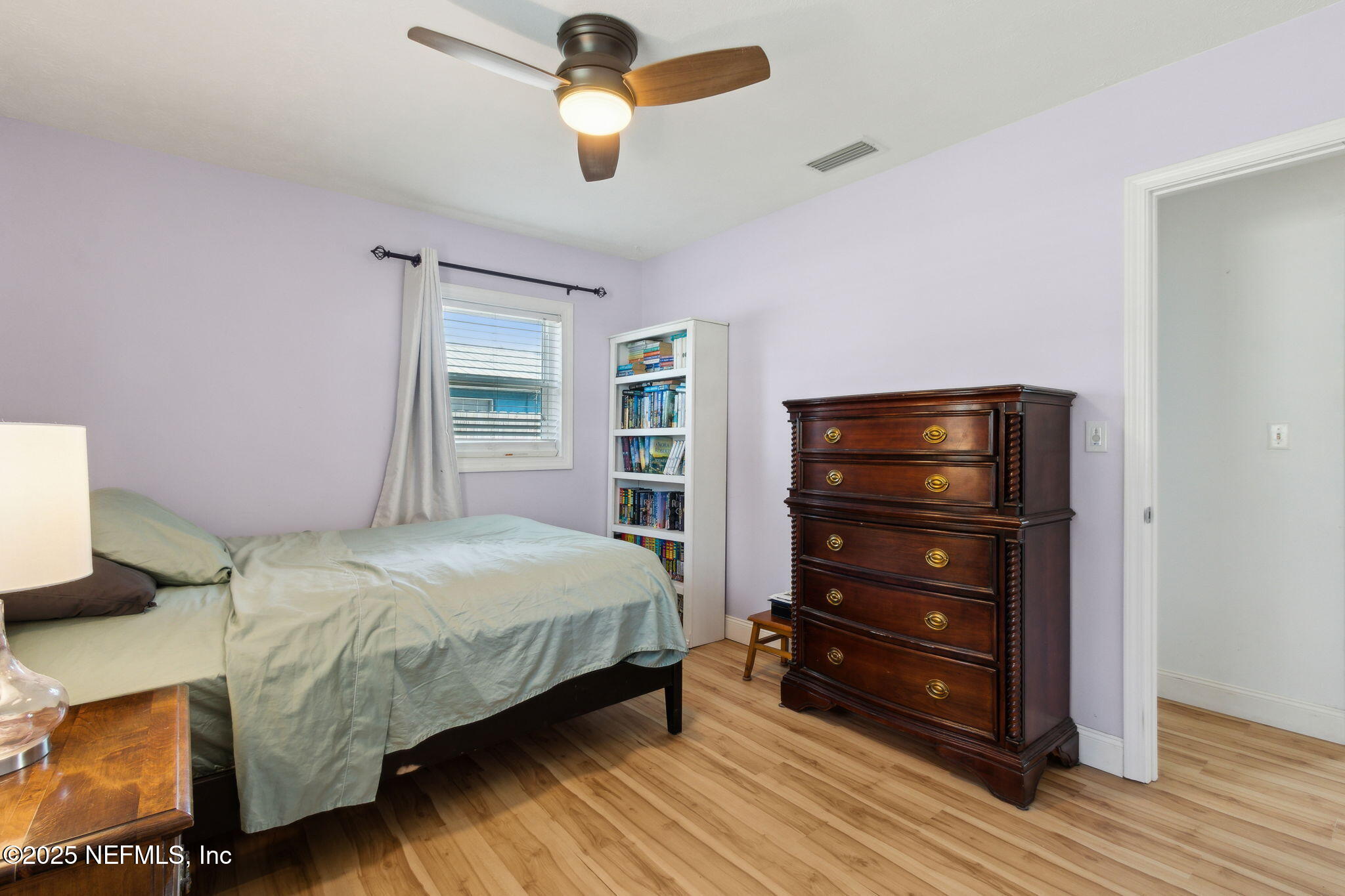 234 Hawthorne Road St. Augustine, FL 32086 - Photo 19 of 29 a bedroom with a bed and wooden floor