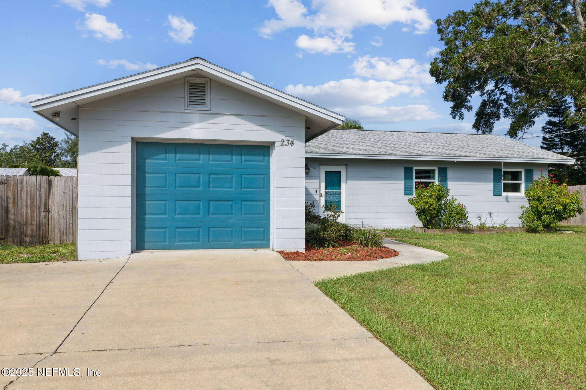 234 Hawthorne Road St. Augustine, FL 32086 - Photo 3 of 29 a front view of a house with a yard and garage