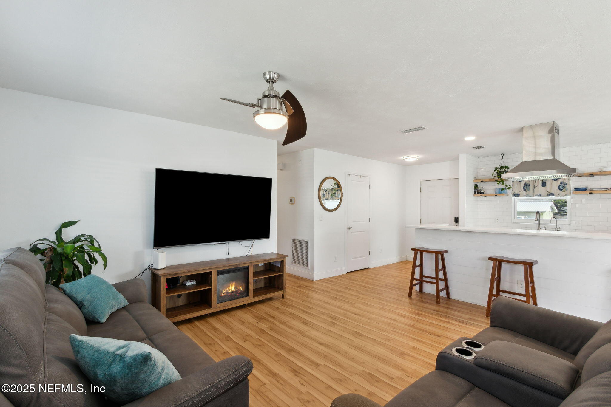 234 Hawthorne Road St. Augustine, FL 32086 - Photo 5 of 29 a living room with furniture and a flat screen tv