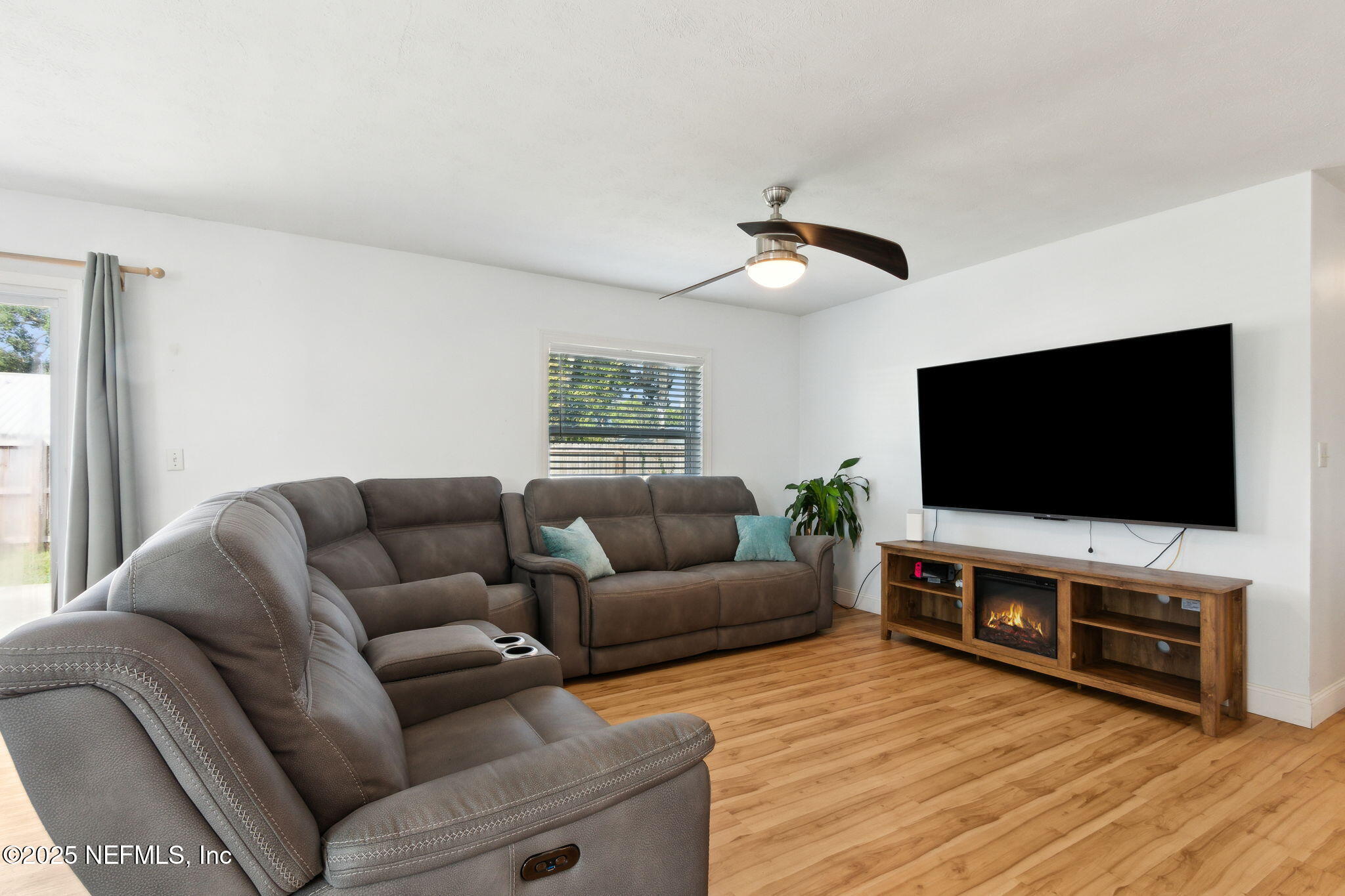 234 Hawthorne Road St. Augustine, FL 32086 - Photo 6 of 29 a living room with furniture and a flat screen tv