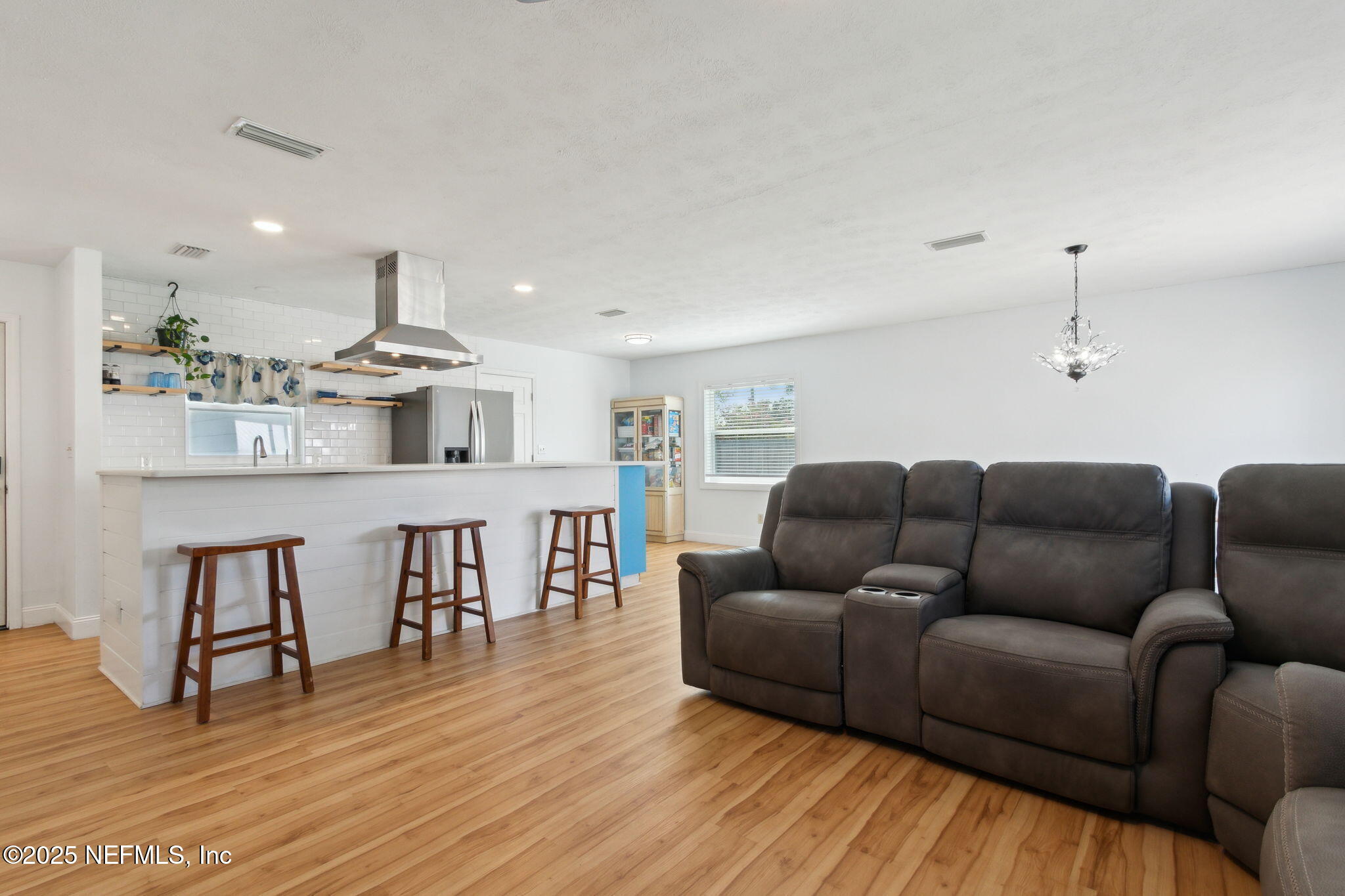 234 Hawthorne Road St. Augustine, FL 32086 - Photo 7 of 29 a living room with furniture and kitchen view