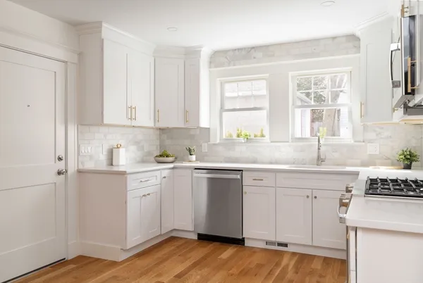 a kitchen with sink cabinets and window