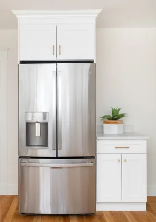 a kitchen with a refrigerator and a sink