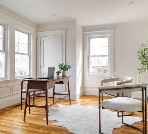a view of a room with furniture window and wooden floor