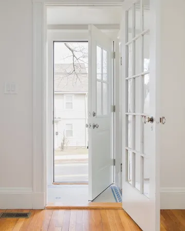 a view of a bathroom with wooden floor and a tub